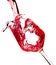 Red wine is pouring into a glass goblet on a white background.