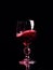 Red wine pouring into wine glass