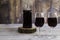 Red wine rustic bottle and two red wine glasses
