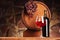 Red wine.Still life with glass and bottle of red wine, grapes and barrel.Selective focus.Wine cellar atmosphere.Copy space