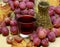 Red wines homemade wicker bottle and grapes