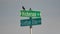 Red-winged blackbird on street signs - cross-section of two rural gravel roads in Northern Wisconsin