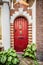 Red wood door on lovely european home