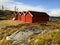 Red wooden buildings of a fishing village in Norway