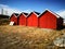 Red wooden buildings of a fishing village in Norway