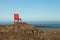 Red wooden chair on a empty stony landscape in Iceland