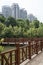 Red wooden curved bridge and buildings