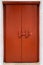 Red wooden door with traditional cross bar lock