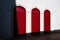 Red wooden doors on the facade of an old house in Tagus Port Belem Lisbon