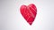 Red wooden heart entangled in a rope and hanging. Festive decorations.