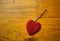 Red Wooden heart on floor boards