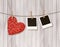 Red wooden heart with photographs.