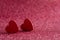 Red wooden hearts on a shiny surface