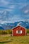 Red wooden house in arctic wilderness. Aktse mountain cabin deep in Sarek National Park, Sweden. Antlers on the wall