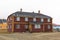 Red wooden house in artic landscape. Ny Alesund, Spitsbergen.