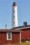 Red wooden houses lighthouse, Ã§Ã§Ã§Ã§xxHailuoto island. Marjaniemi beach. Finland