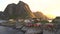 Red wooden huts, known as Rorbu, in the village of Reine on the Hamnoy island