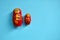 Red wooden matryoshka doll on the blue background