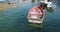 Red wooden rowing boat in the port of Portofino, Italy, Europe.