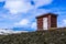 Red wooden shed standing on the hill