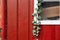 red wooden wall with ivy plants