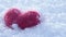 Red woolen heart on lying on the white clear snow in winter