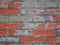 Red Worn Repaired Brickwall with Uneven Mortar