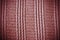 Red woven striped material background or texture