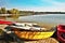 Red and yellow boats and pedal boats in shore of the Alum Lake Kamencove jezero in Chomutov in the region Ustecky kraj at the end