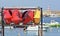 Red and yellow canoes in a stand at the harbor