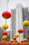 Red and yellow Chinese lanterns on a background of white skyscrapers. concept of contrast of old traditions and modern world