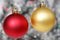Red and Yellow Christmas ball against background of christmas li