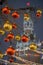 Red and yellow Christmas balls on branch. On the background in the defocus of the with Christmas lights with view on Spasskaya