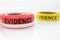 Red and yellow evidence tape on white background