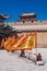 Red and yellow flags in front of traditional Chinese buildings a