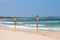 Red and yellow flags on patrolled beach indicating safe to swim area