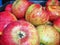 Red, yellow and green apples jonagored in the box. fruit. Apple production.Background Background texture.