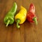 Red, yellow and green Italian long peppers