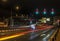 Red and yellow light trails on a highway traffic light crossing.