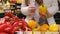 Red and yellow peppers for sale at a local farmers market, fresh harvest.