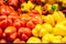 Red and yellow peppers on the shop window in the store.