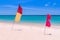 Red and yellow-red flags on the empty beach