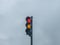 Red and yellow semaphore signal with cloudy dramatic sky
