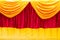 Red and yellow stage theater curtain as a background