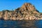 red yellow stone cliffs, coast of Black sea with reflections in waves on a bright sun light