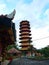 A red and yellow tower Buddhist temple with oriental Chinese architecture design