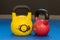 Red and yellow used and old kettlebells. Workout equipment
