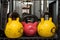 Red and yellow used and old kettlebells. Workout equipment