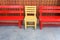 Red and Yellow wooden bench chairs in park