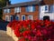 Redbrick house and geraniums